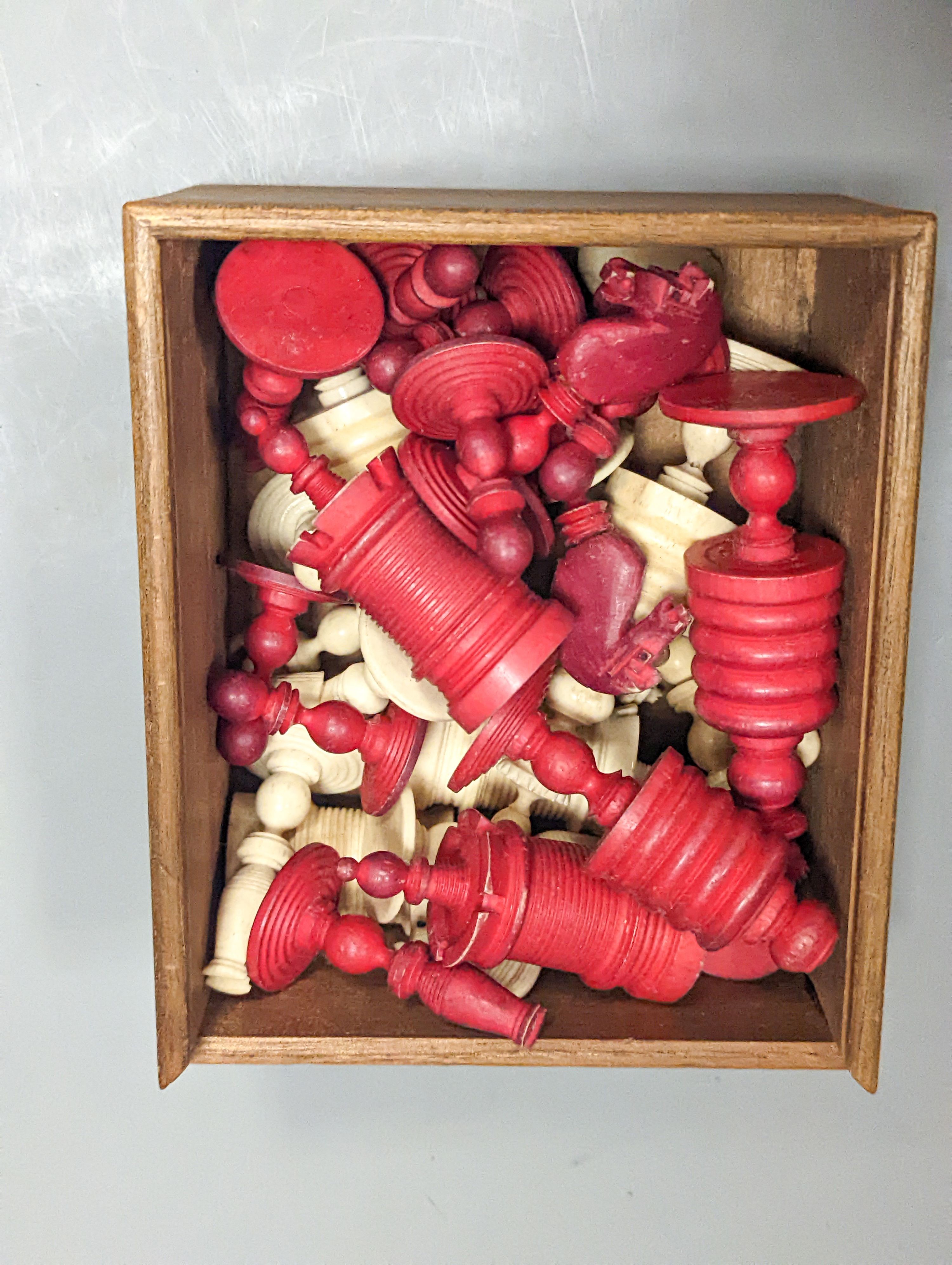 A 19th century turned ivory and bone chess set